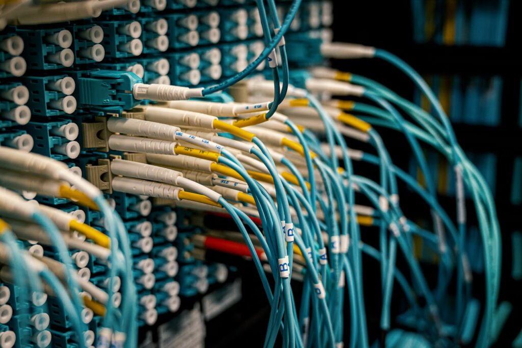 pexels photo 4280696 Fiber optical device with similar bright connectors with blue cables made of rubber with plastic pigtails on edges