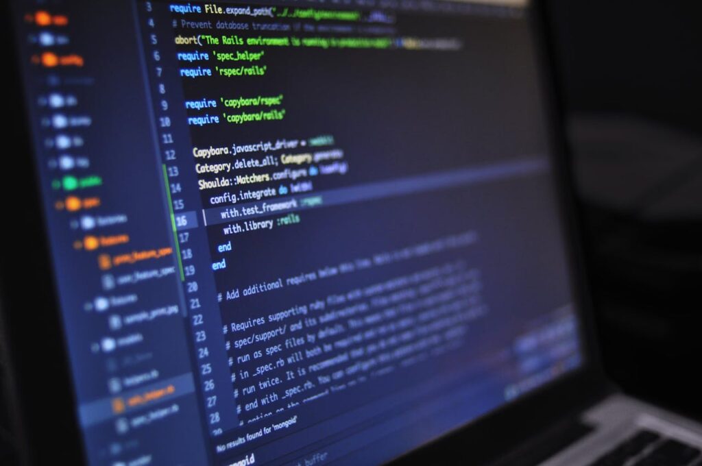 pexels photo 546819 Close-up of a computer screen displaying programming code in a dark environment.
