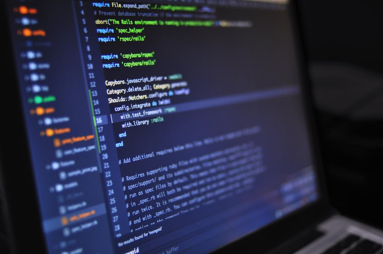 journey Close-up of a computer screen displaying programming code in a dark environment.